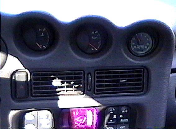 2 stock gauges and VDO vac/boost gauge